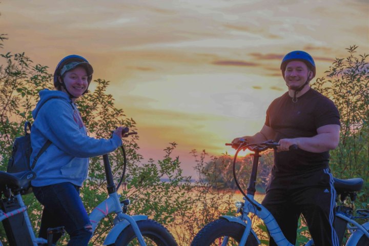 Suzanne Grant standing next to a bicycle