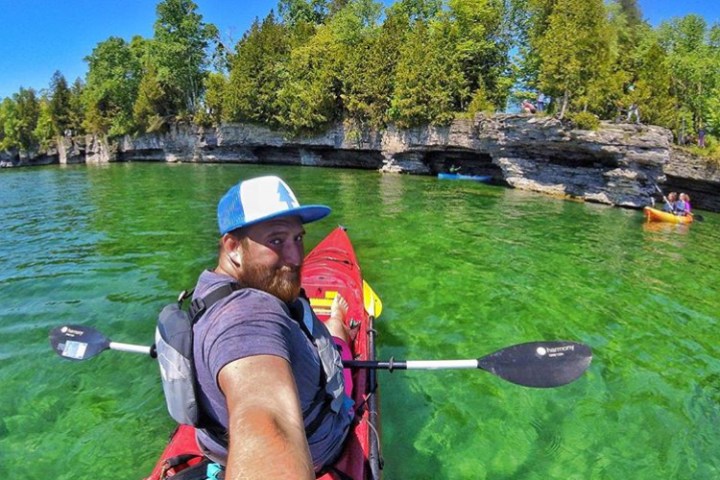 a person rowing a boat in the water