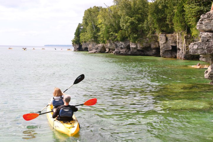 a couple of kayakers paddling at Cave Point County Park