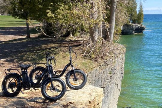 a bicycle is parked next to a body of water