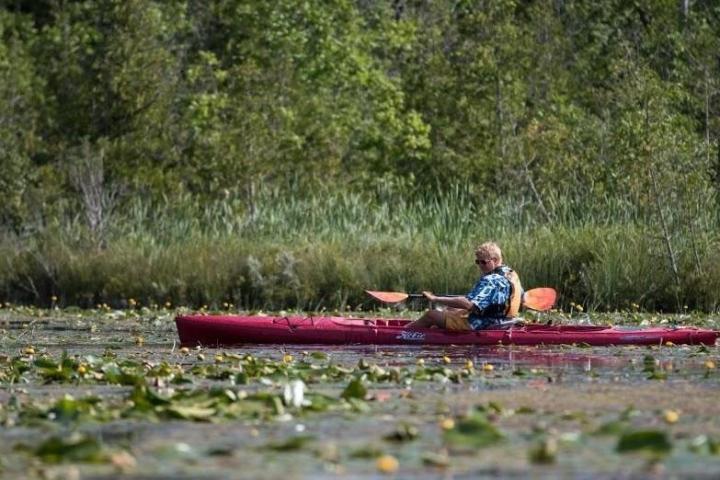 a man riding on the back of a boat