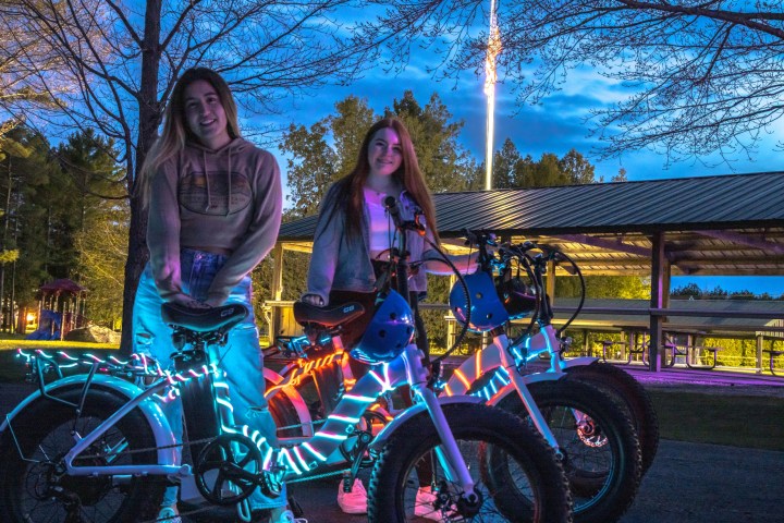 a person standing in front of a motorcycle